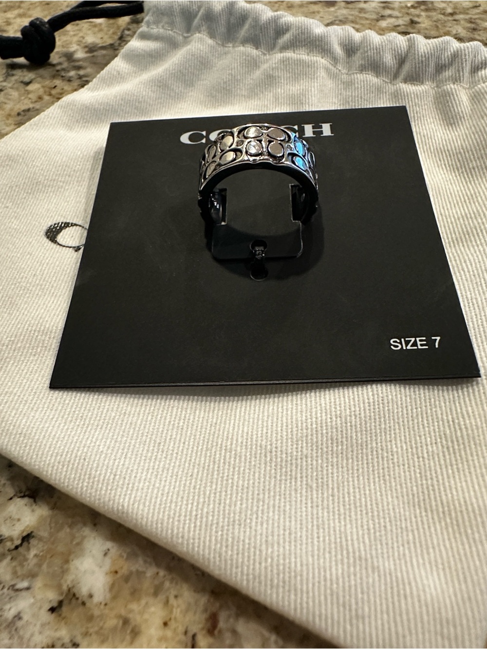 Coach Silver-Tone Crystal Quilted C
Wide Band Ring - Size 7 - Picture 3 of 3